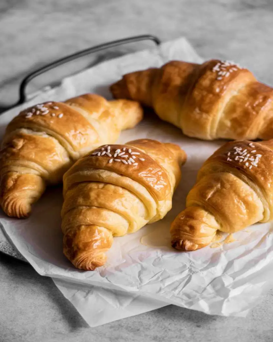 Croissant recipes fresh from oven on wooden table