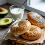 Healthy bagel recipe on rustic table with toppings