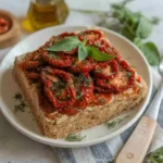 Sundried tomato recipes ingredients on a rustic board